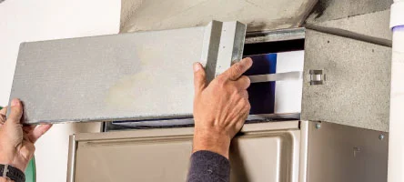 High-efficiency whole-home air filter mounted at the air handler