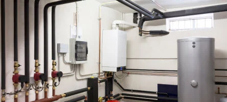 Large commercial boiler installed in a mechanical room